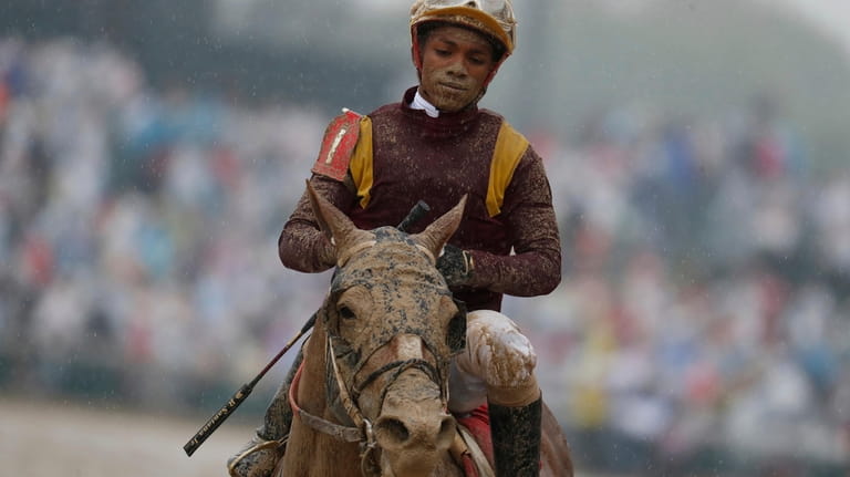 Ricardo Santana Jr. is covered in mud after riding Whitmore...