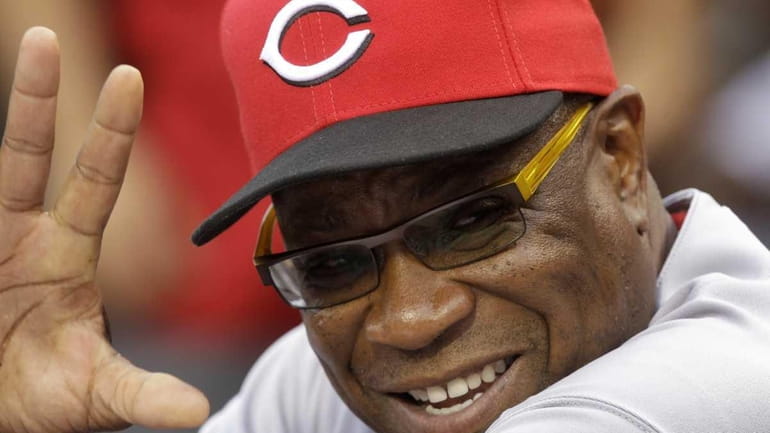 Cincinnati Reds manager Dusty Baker waves to a fan before...