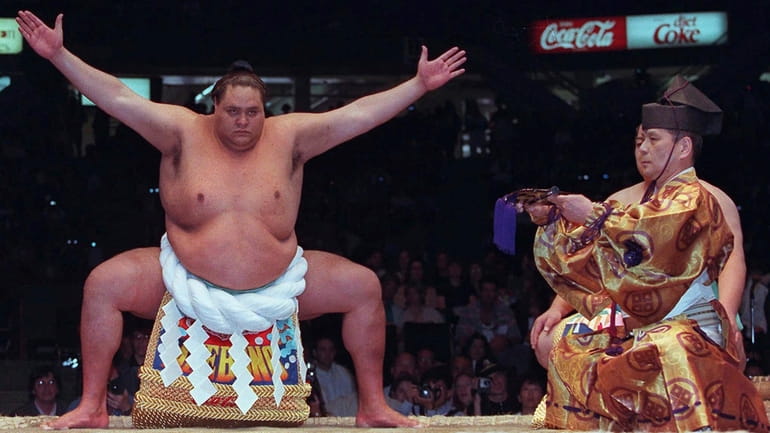 Hawaiian-born Taro Akebono, Japan's top Sumo wrestler, takes part in...
