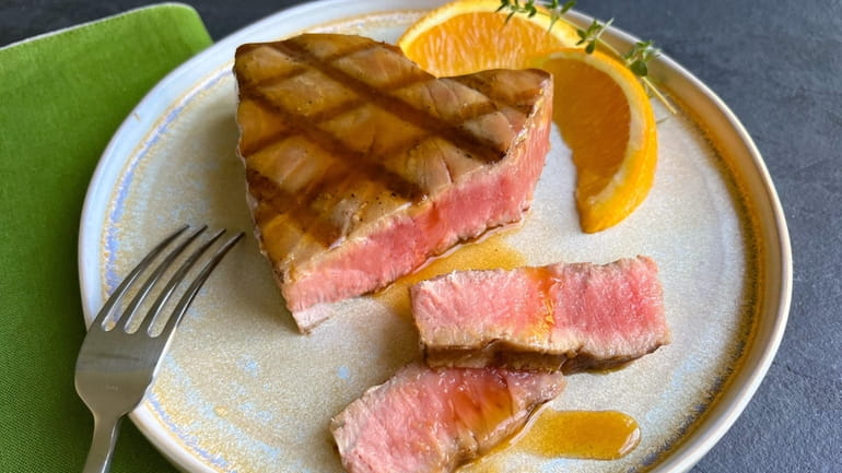 Grilled tuna topped with a simple orange teriyaki sauce (June...