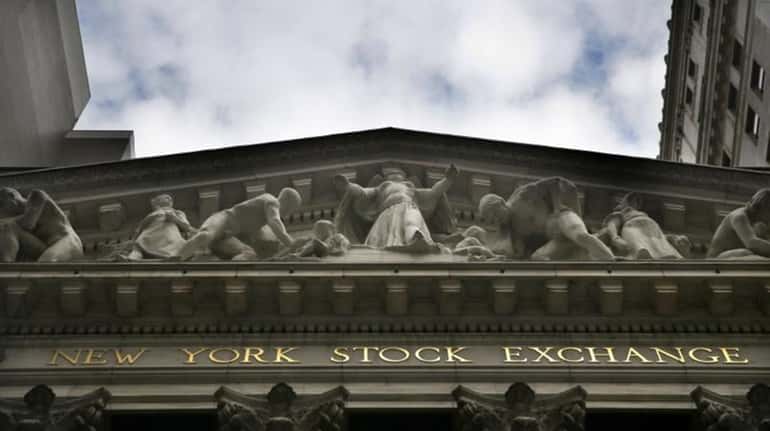 Stocks were slightly lower early Wednesday, Nov. 4, 2015, as...
