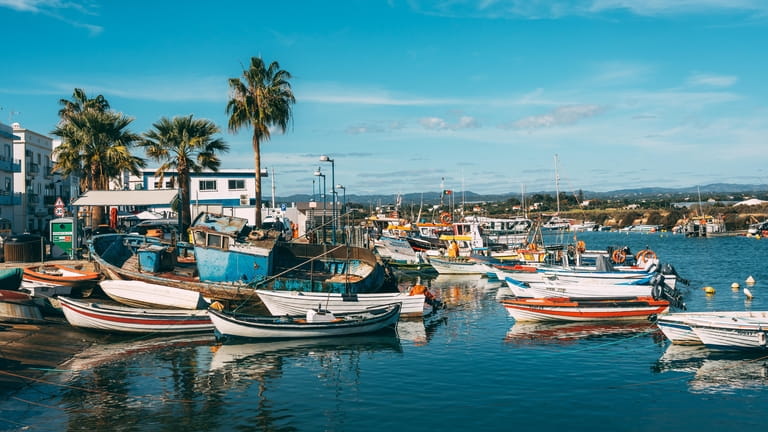 Boats in the Fuseta harbor in the Algarve in the...