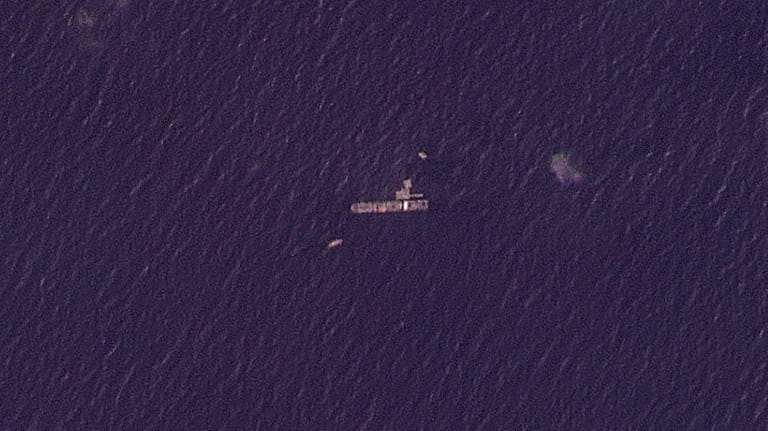 This satellite photo from Planet Labs PBC shows the USNS...