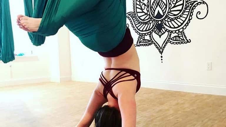 Kelly Hinshaw practices aerial yoga and will lead a workshop...