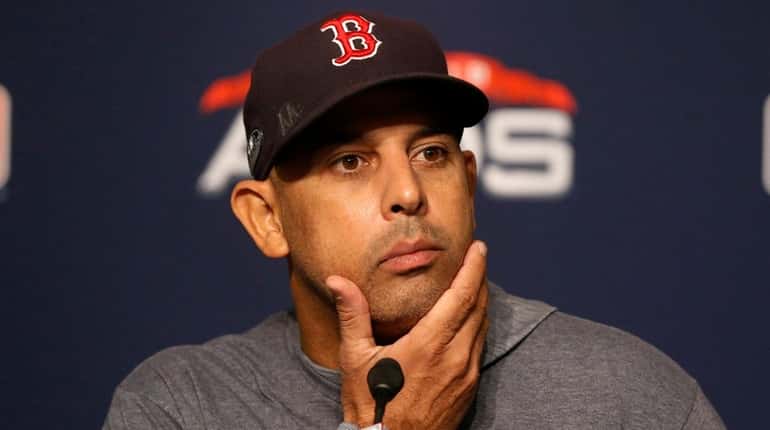 Manager Alex Cora of the Boston Red Sox speaks to...