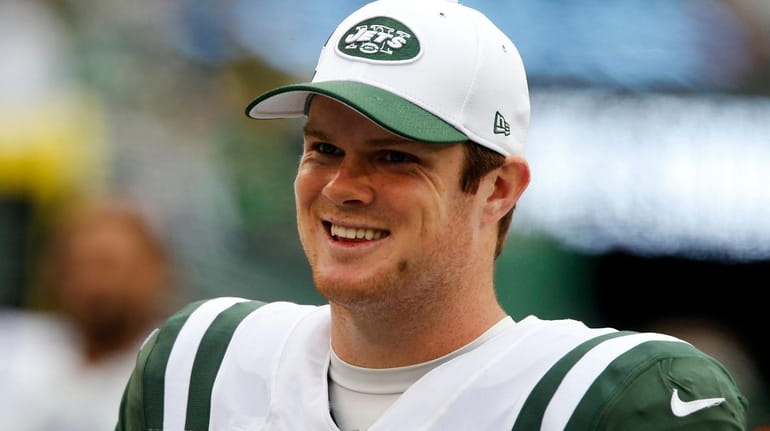 Sam Darnold #14 of the New York Jets smiles from...
