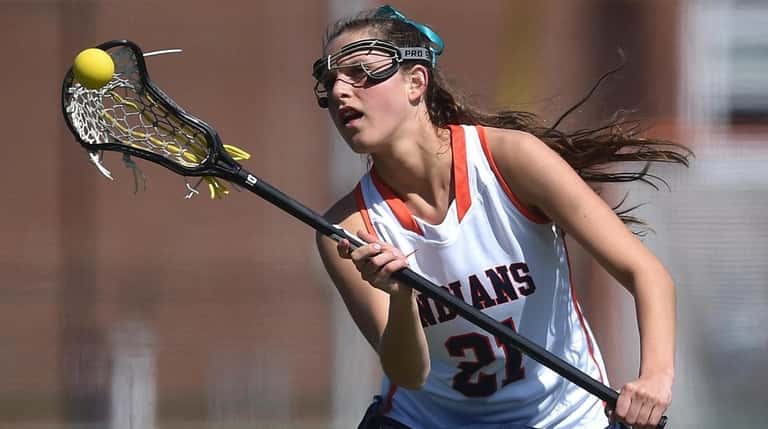 Olivia Dooley of Manhasset looks a pass into the webbing...