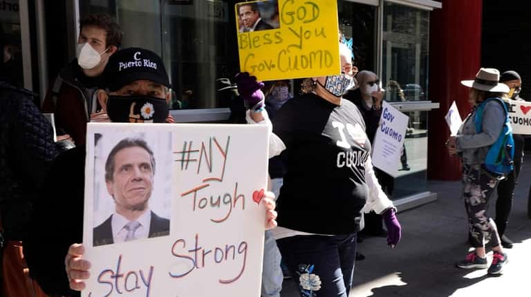 Gov. Cuomo's supporters rally in front of his Manhattan office...
