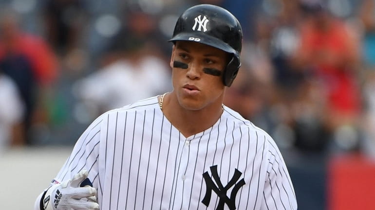 Yankees rightfielder Aaron Judge reacts on second base after his RBI...