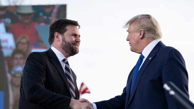 J.D. Vance, left, with former President Donald Trump. Vance, a...