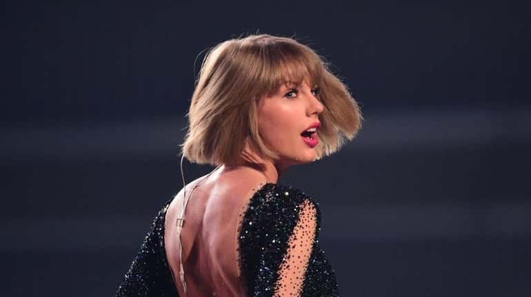 Taylor Swift performs during the 58th annual Grammy Awards in...