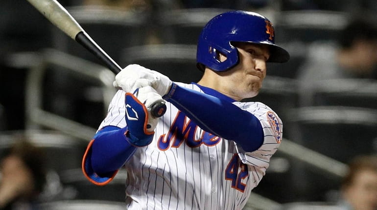Brandon Nimmo of the Mets follows through on his fifth-inning two-run...