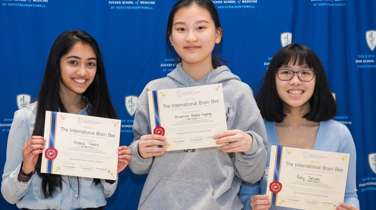 Breanna Huang-Ouyang, center, a junior at Plainview-Old Bethpage John F. Kennedy...
