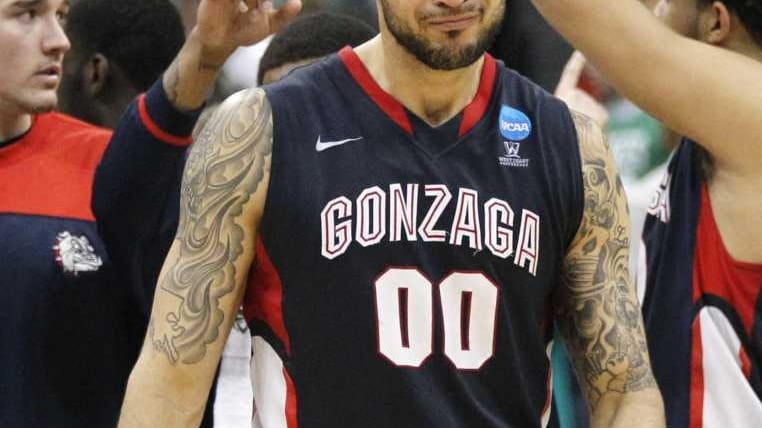 Gonzaga's Robert Sacre (0) leaves the court after losing 73-66...