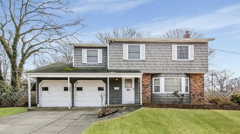 This Brentwood Colonial, for $409,000, includes four bedrooms and 2-1/2...