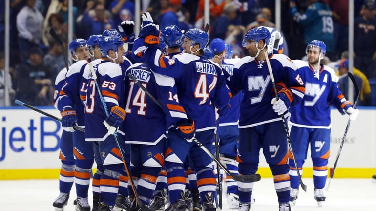 The Islanders celebrate after defeating the San Jose Sharks at...