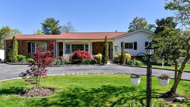 Priced at $929,000, this ranch on Syosset-Woodbury Road is near...