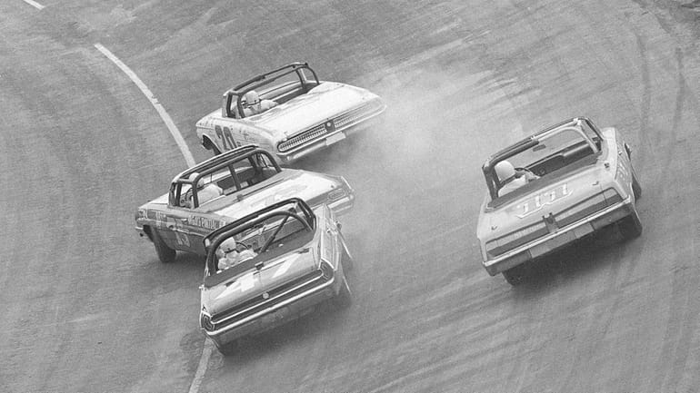 Ralph Earnhardt (75), far left, starts to spin out as...