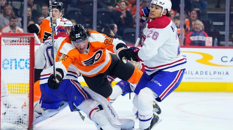 Philadelphia Flyers' Brendan Lemieux (22) collides with Montreal Canadiens' Johnathan...