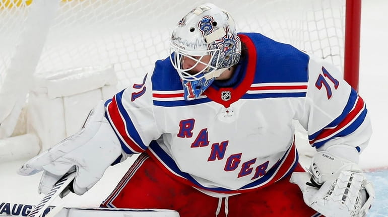 The Rangers' Keith Kinkaid blocks a shot during the second...