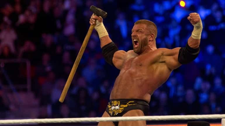 Triple H celebrates his victory against Brock Lesnar during WrestleMania...