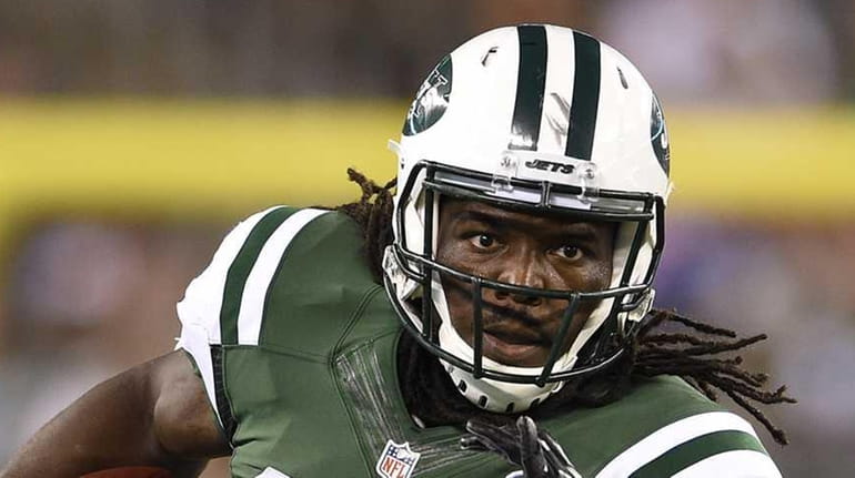 Jets running back Chris Ivory runs for yards after a...