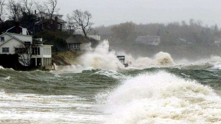 Homes by Southold Town Beach in Southold get pounded by hurricane...