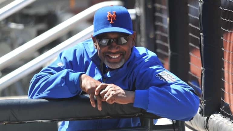 New York Mets manager Jerry Manuel smiles before a game...