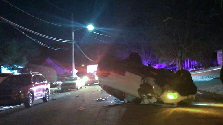 A car overturned in a two-vehicle crash in Port Jefferson...