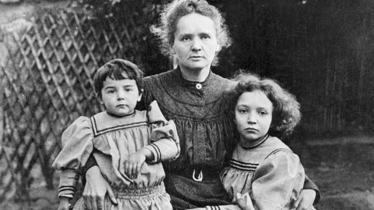 Marie Curie, pictured in a 1908 photo with her daughters...