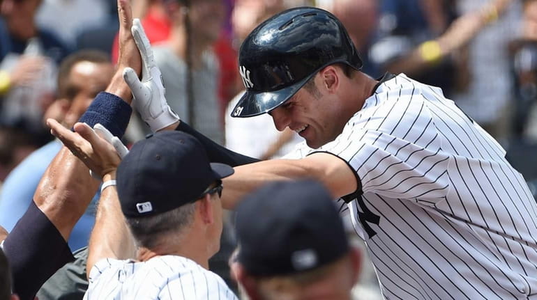New York Yankees manager Joe Girardi greets Yankees first baseman...