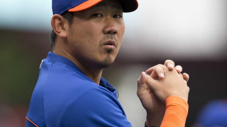 Pitcher Daisuke Matsuzaka of the Mets warms up prior to...