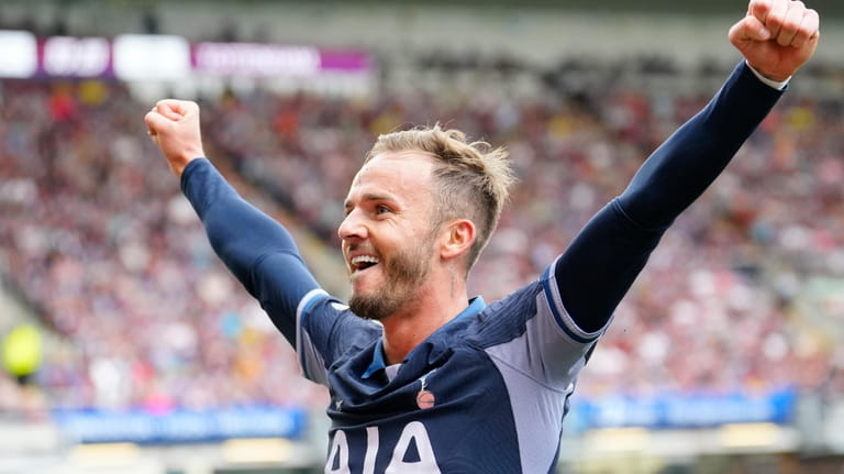 Tottenham's James Maddison celebrates after scoring his side's third goal...