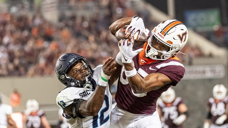 Virginia Tech's Kyle Lane, right, makes a catch against Old...