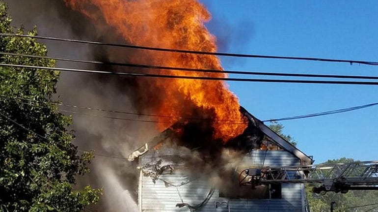 A firefighter was injured battling a blaze that ravaged a...