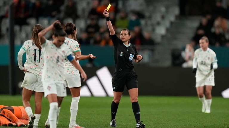 Portugal's Diana Gomes, center left, receives a yellow card during...