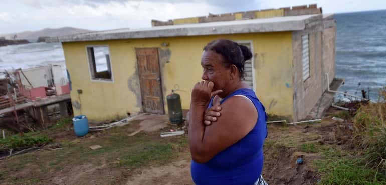 Maria Martinez and her hurricane-damaged house in eastern Puerto Rico, Sept....
