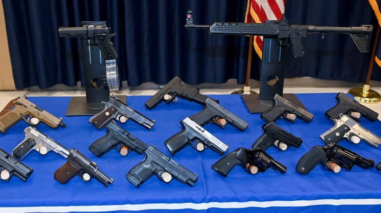 Illegal guns seized from a multistate trafficking ring on display...