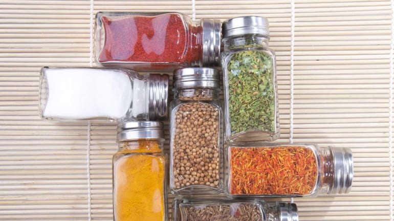 Square, glass spice bottles stack easily.