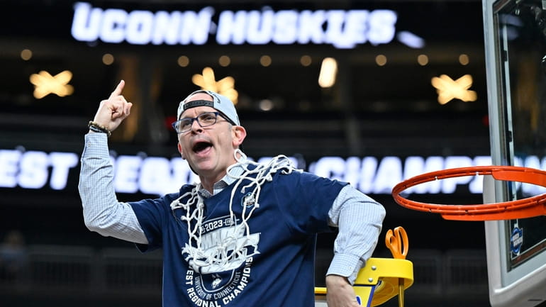 UConn head coach Dan Hurley celebrates after cutting down the...