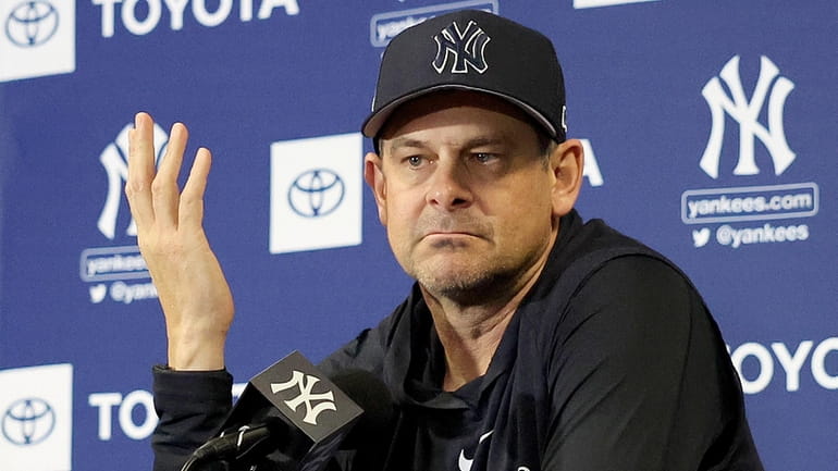 Yankees manager Aaron Boone speaks with the media during a...