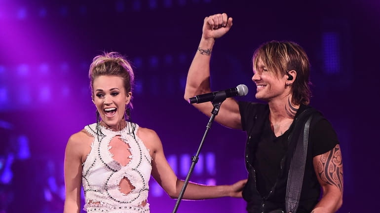 Carrie Underwood and Keith Urban perform during the 2017 CMT...
