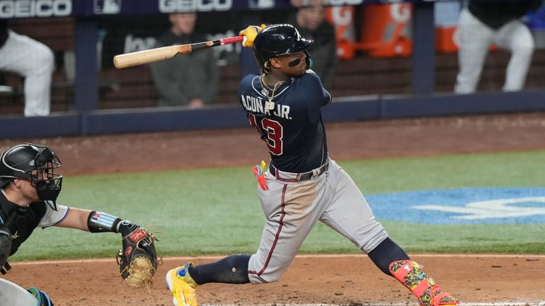 Atlanta Braves Ronald Acuna Jr. (13) hits a three-run-home run...