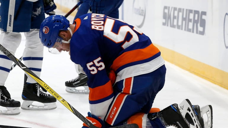 Johnny Boychuk of the Islanders is injured late during the...
