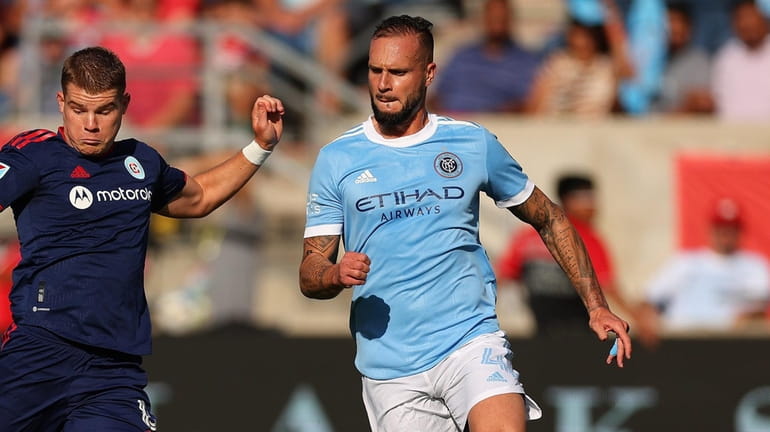 Maxime Chanot #4 of New York City FC (right) defends...