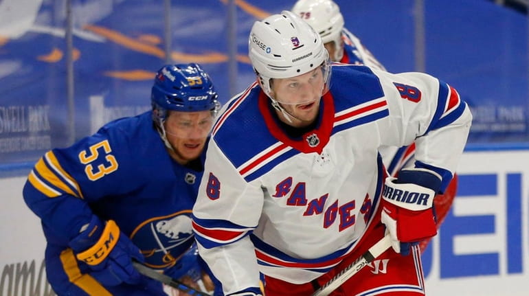 Rangers defenseman Jacob Trouba carries the puck during the second period...