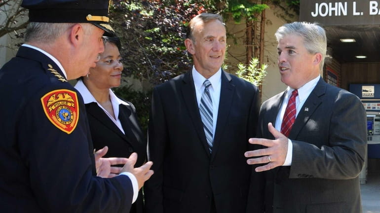 Suffolk County Executive Steve Bellone talks to newly appointed police...