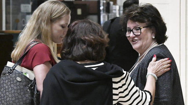 State Education Commissioner MaryEllen Elia, right, talks with well-wishers after...