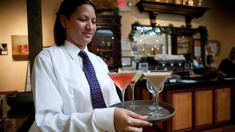 A waitress serves drinks.  (June 22, 2010)