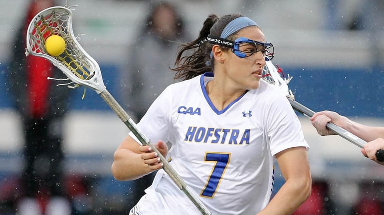 Hofstra's Alyssa Parrella (7) takes that ball to the net...
